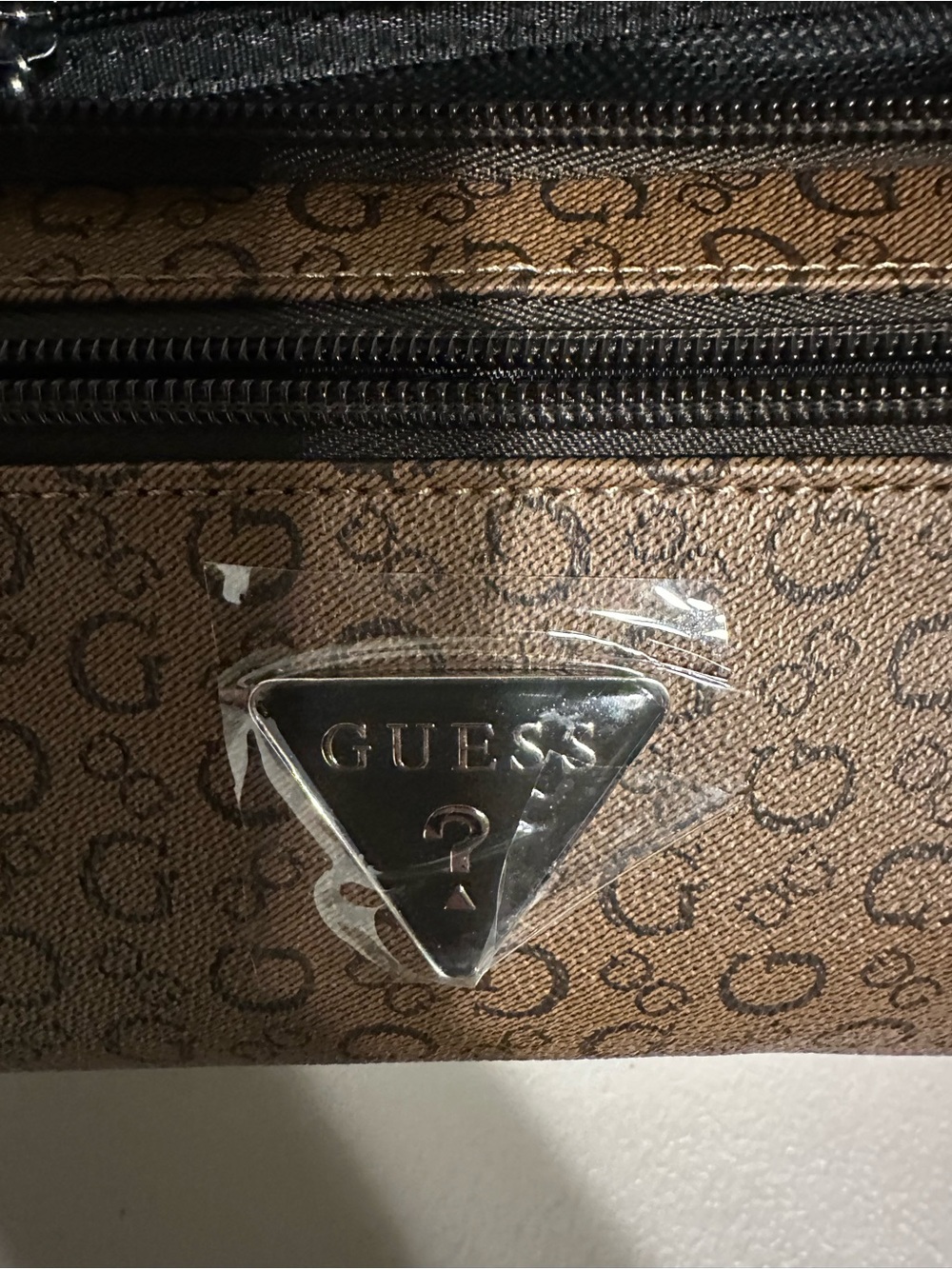 GUESS Brown Monogram toiletry bag with Silver Plaque